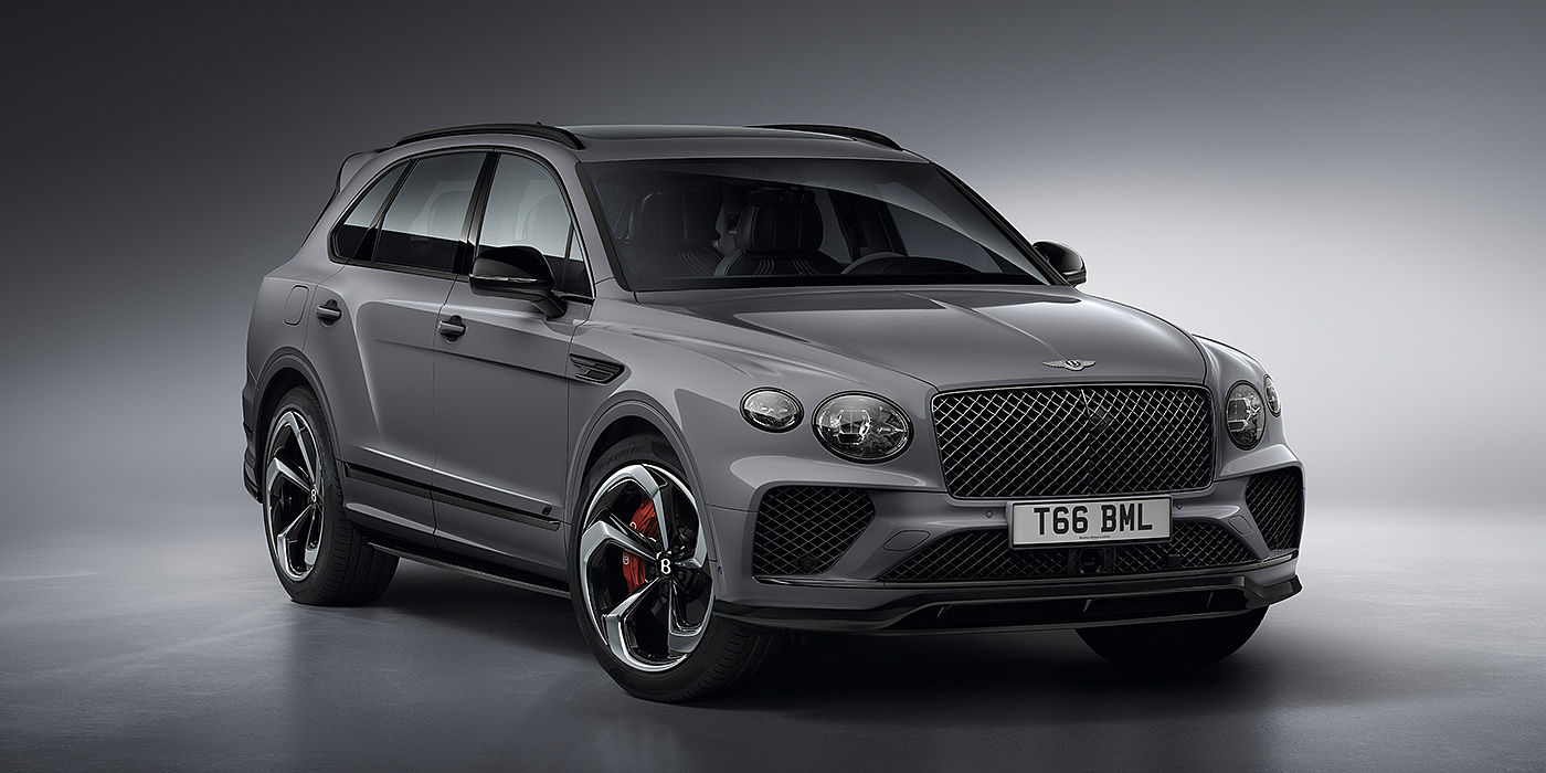 Bentley Mougins Bentley Bentayga S in Cambrian Grey paint front three - quarter view with dark chrome matrix grille and featuring elliptical LED matrix headlights. 