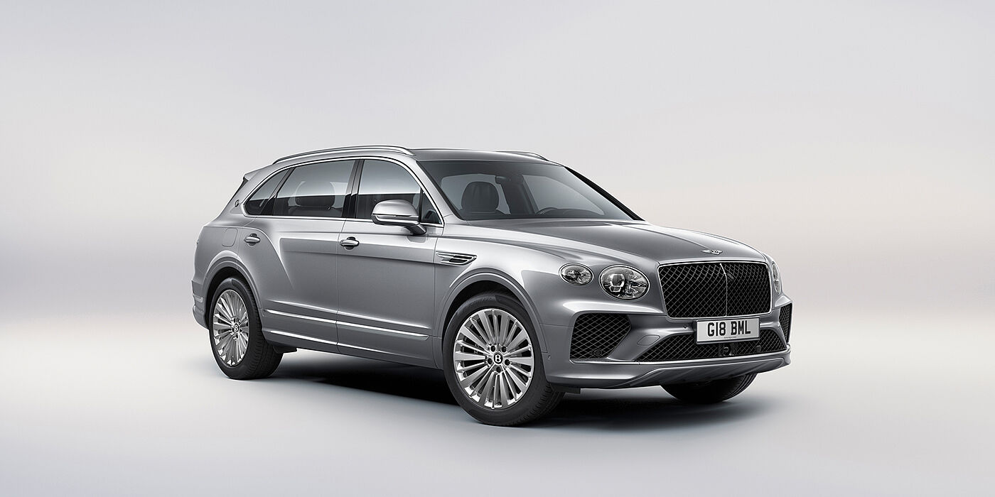 Bentley Mougins Bentley Bentayga Extended Wheelbase luxury SUV front three quarter view in Moonbeam paint with 21 inch five spoke painted wheels