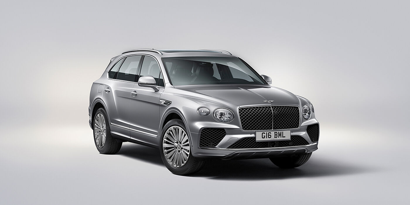 Bentley Mougins Bentley Bentayga luxury SUV front three quarter view in Moonbeam paint with matrix grille and 21″ 5 spoke painted wheels