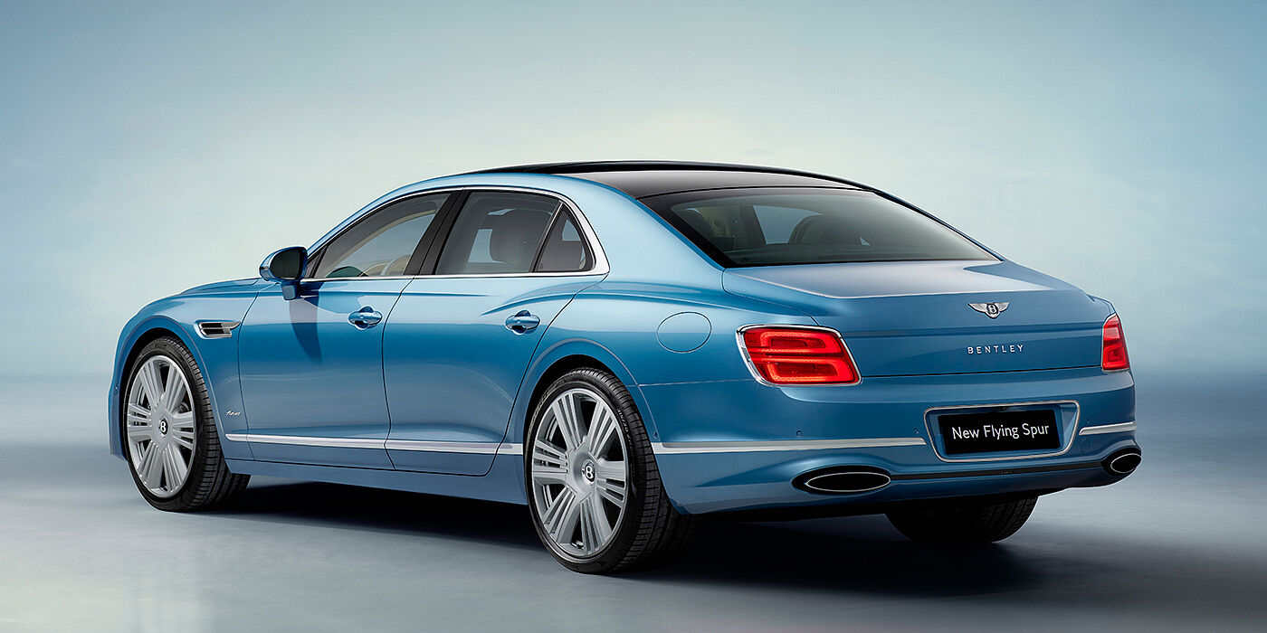 Bentley Mougins New Bentley Flying Spur Azure sedan rear view in Light windsor blue by Mulliner paint with 22 inch Azure wheels and chrome exterior details