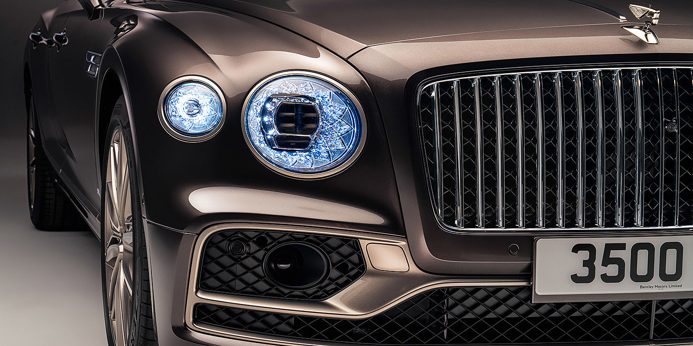 Bentley Mougins Bentley Flying Spur Odyssean sedan front grille and illuminated led lamps with Brodgar brown paint