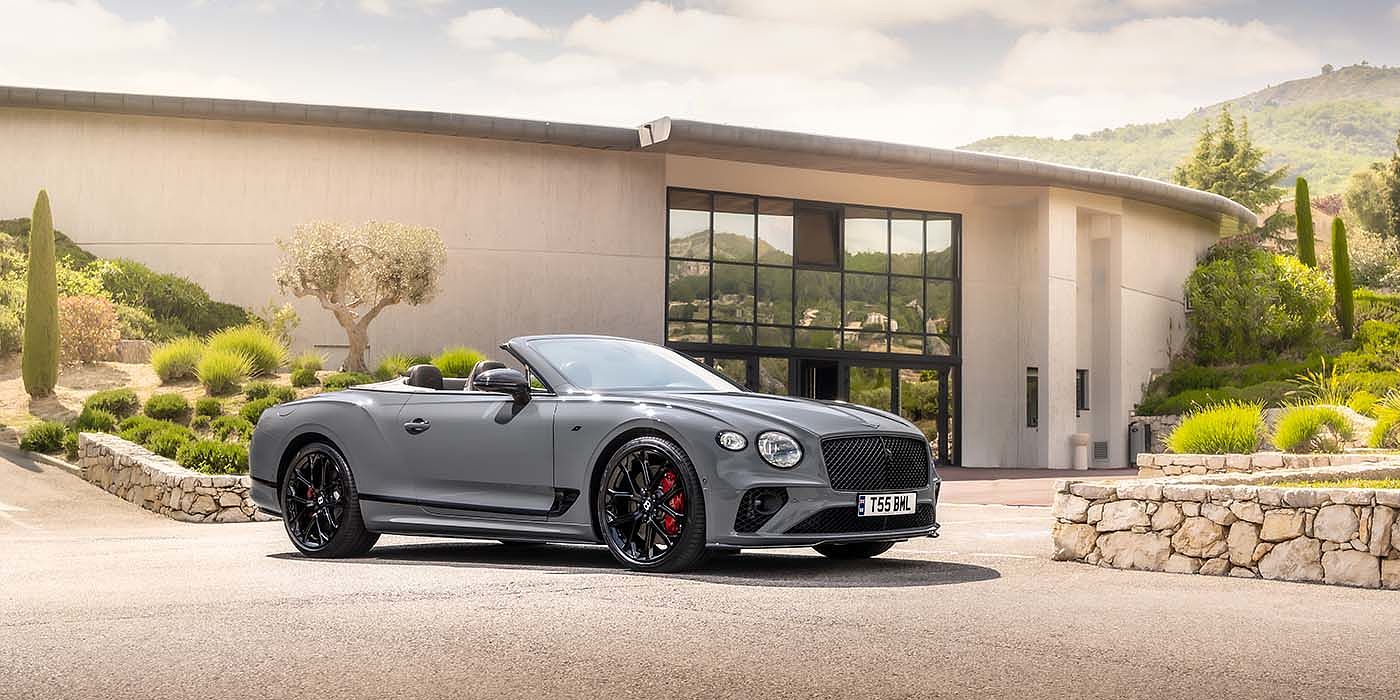 Bentley Mougins Bentley Continental GTC S convertible in Cambrian Grey paint front 34 static near house