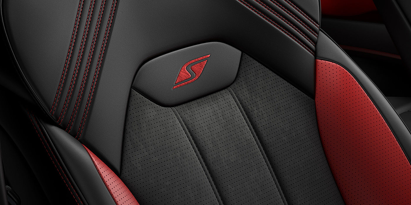 Bentley Mougins Bentley Bentayga S seat with detailed red Hotspur stitching and black Beluga coloured hide. 