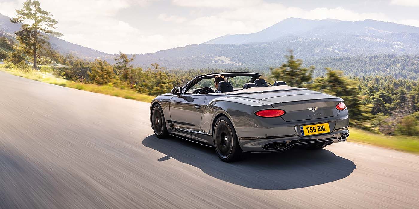 Bentley Mougins Bentley Continental GTC S convertible in Cambrian Grey paint rear 34 dynamic driving
