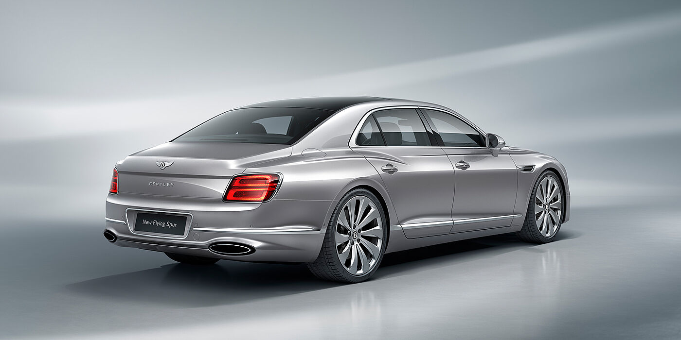 Bentley Mougins New Bentley Flying Spur sedan rear view in Silverlake paint with ten spoke wheels and chrome matrix grille