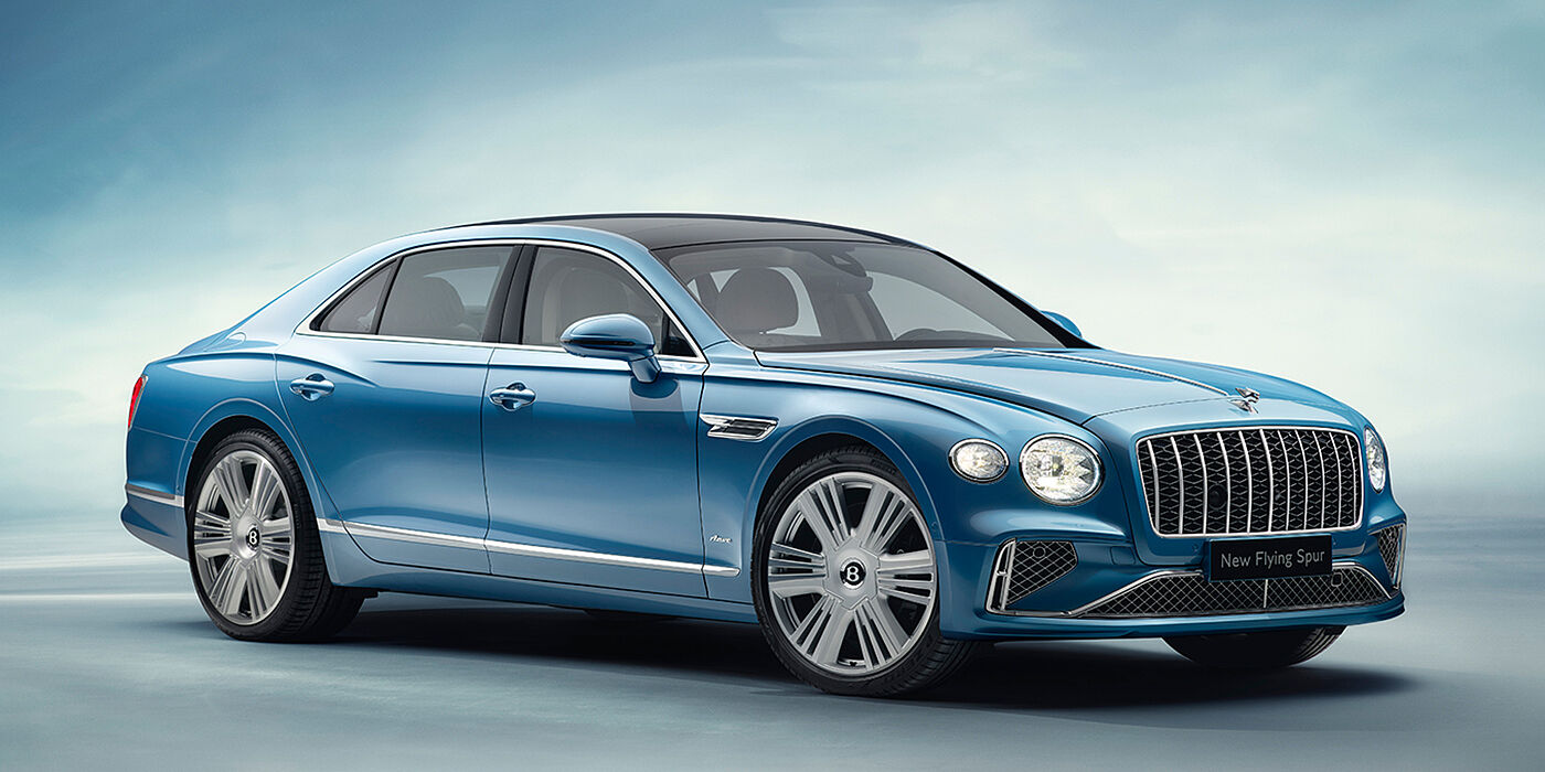 Bentley Mougins New Bentley Flying Spur Azure sedan front view in Light windsor blue by Mulliner paint with 22 inch Azure wheels and chrome exterior details