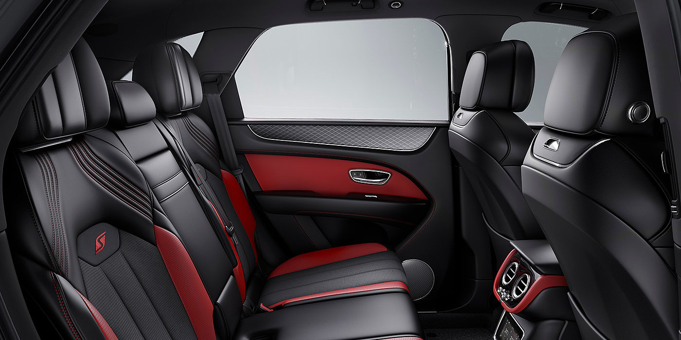 Bentley Mougins Bentey Bentayga S interior view for rear passengers with Beluga black and Hotspur red coloured hide.