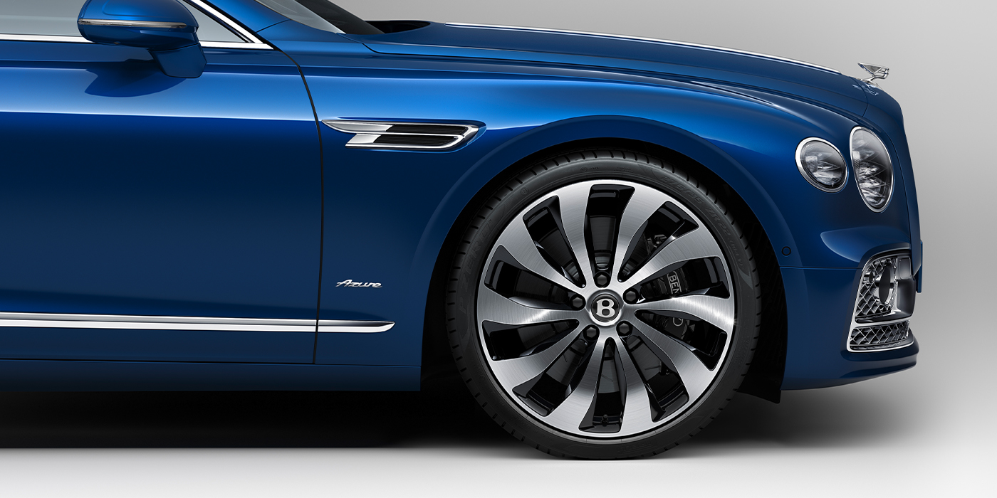 Bentley Mougins Bentley Flying Spur Azure sedan side close up in Sequin Blue paint with Azure badge