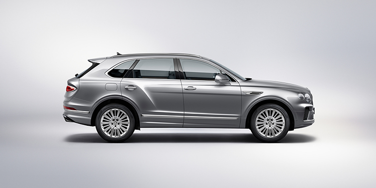 Bentley Mougins Bentley Bentayga SUV side profile in Moonbeam silver paint against white background featuring 21 inch 5 spoke wheels