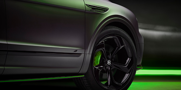 Bentley Mougins Bentley Bentayga S Black Edition SUV exterior wheel detail with Cyber Green brakes with Anthracite Satin paint